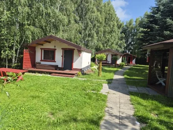 Cottages among greenery, path between the cottages