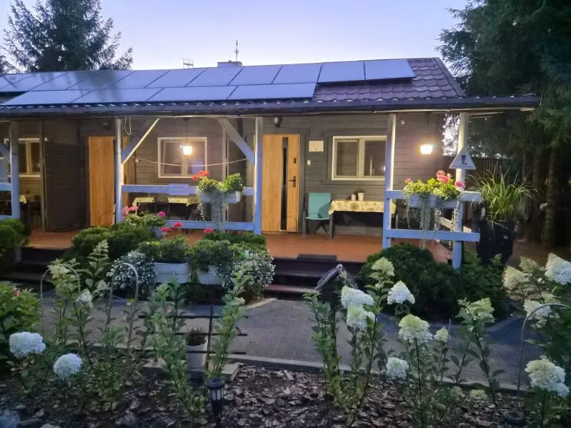 Cottage terrace with flowers at dusk