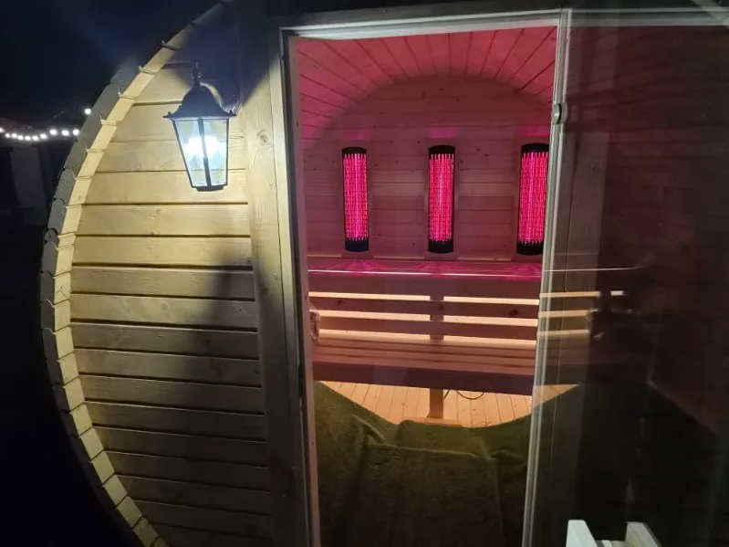 Entrance to the barrel sauna in the evening